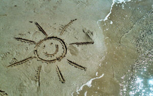 Sonne in Strand gemalt